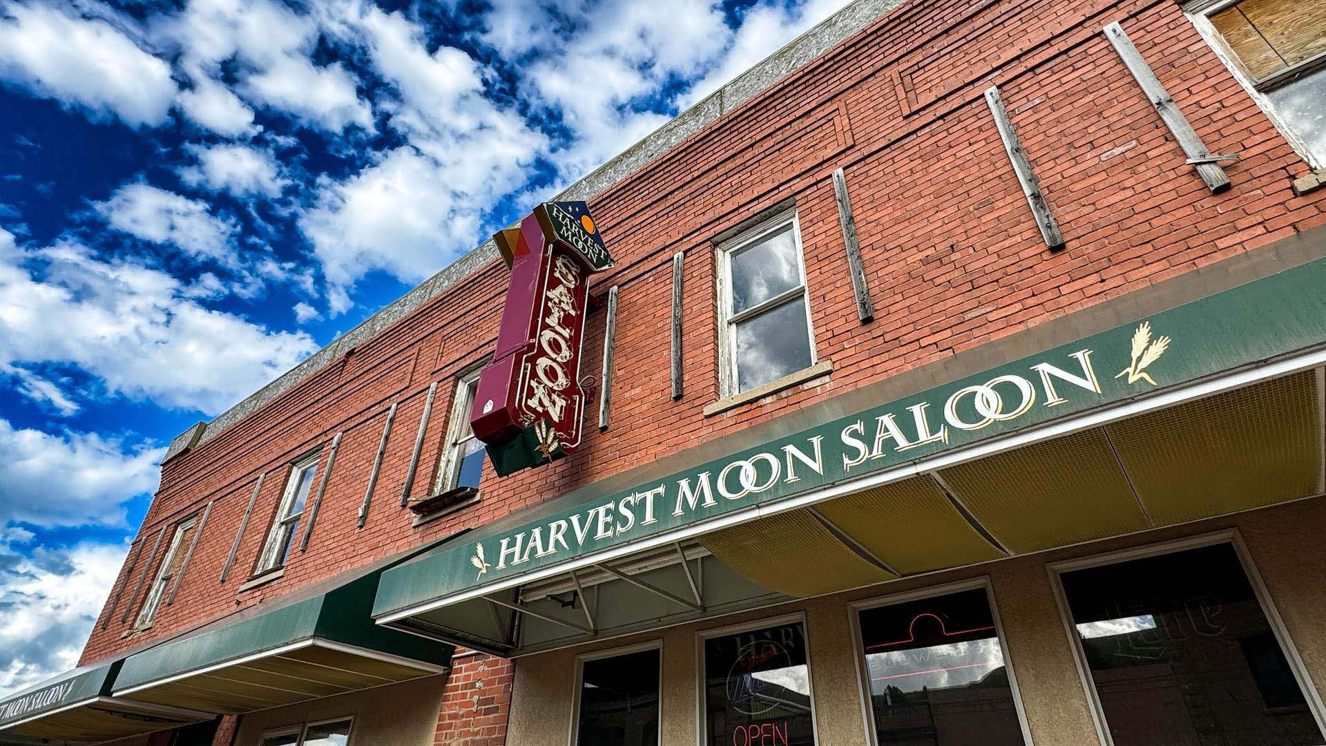 Looking up at a saloon sign in downtown Belt, MT